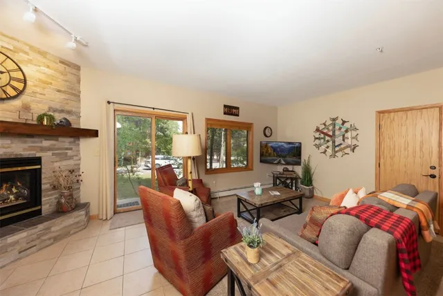 a bedroom with furniture and a fireplace