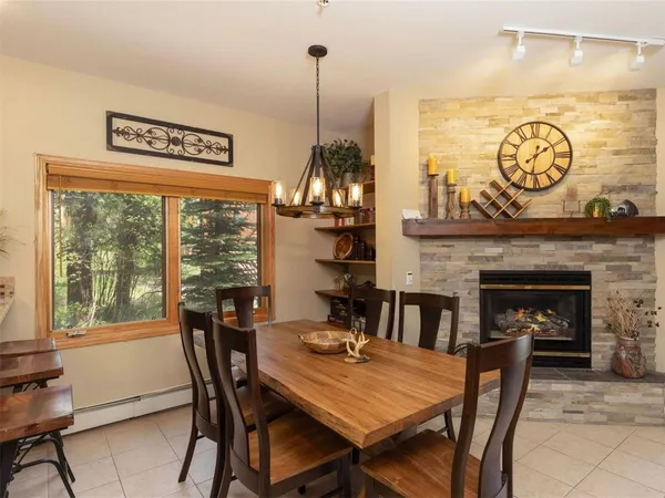 a view of a dining room with furniture window and outside view