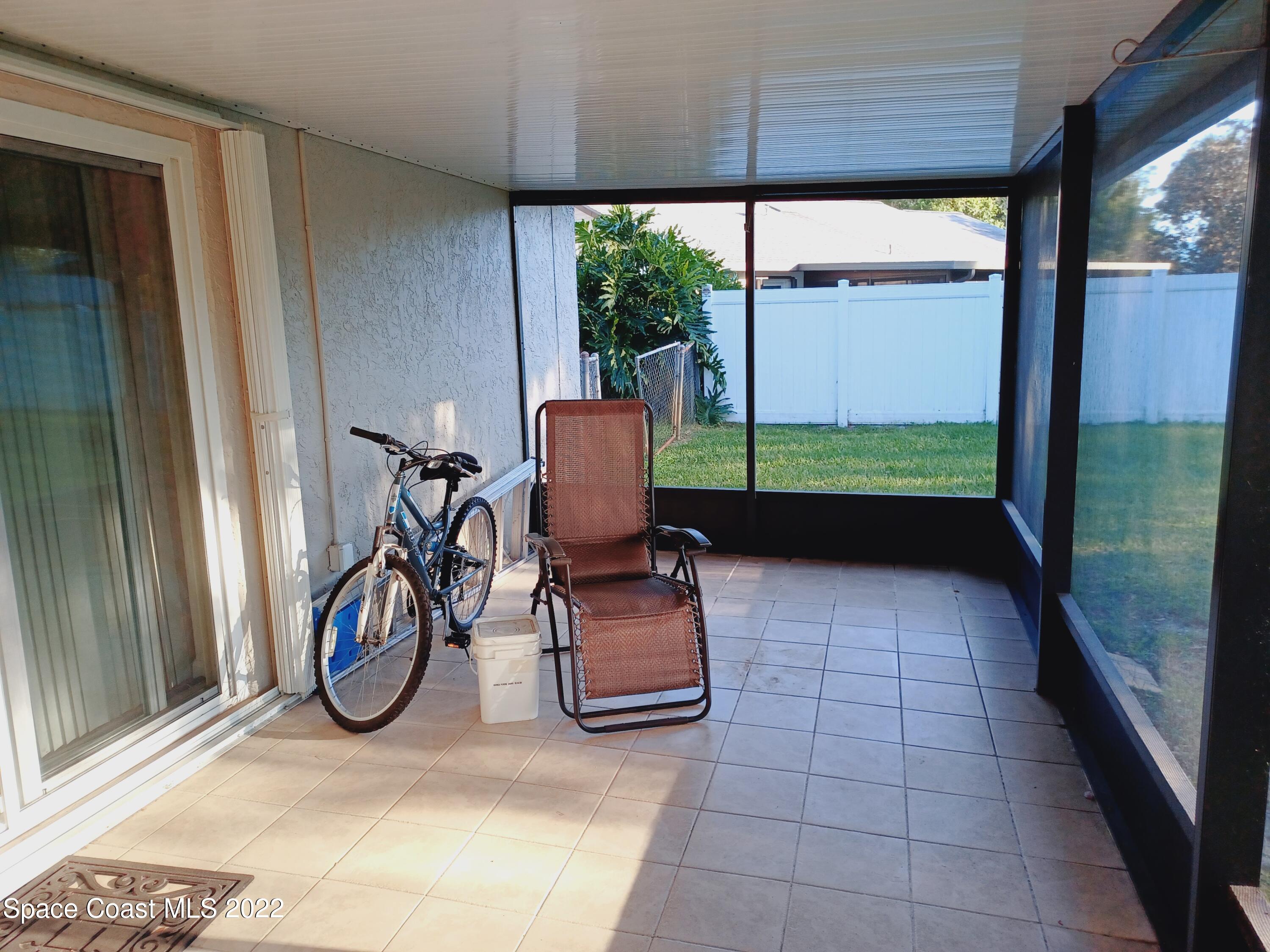 5480 Flint Road Cocoa, FL 32927 - Photo 11 of 20 a view of a porch with chairs
