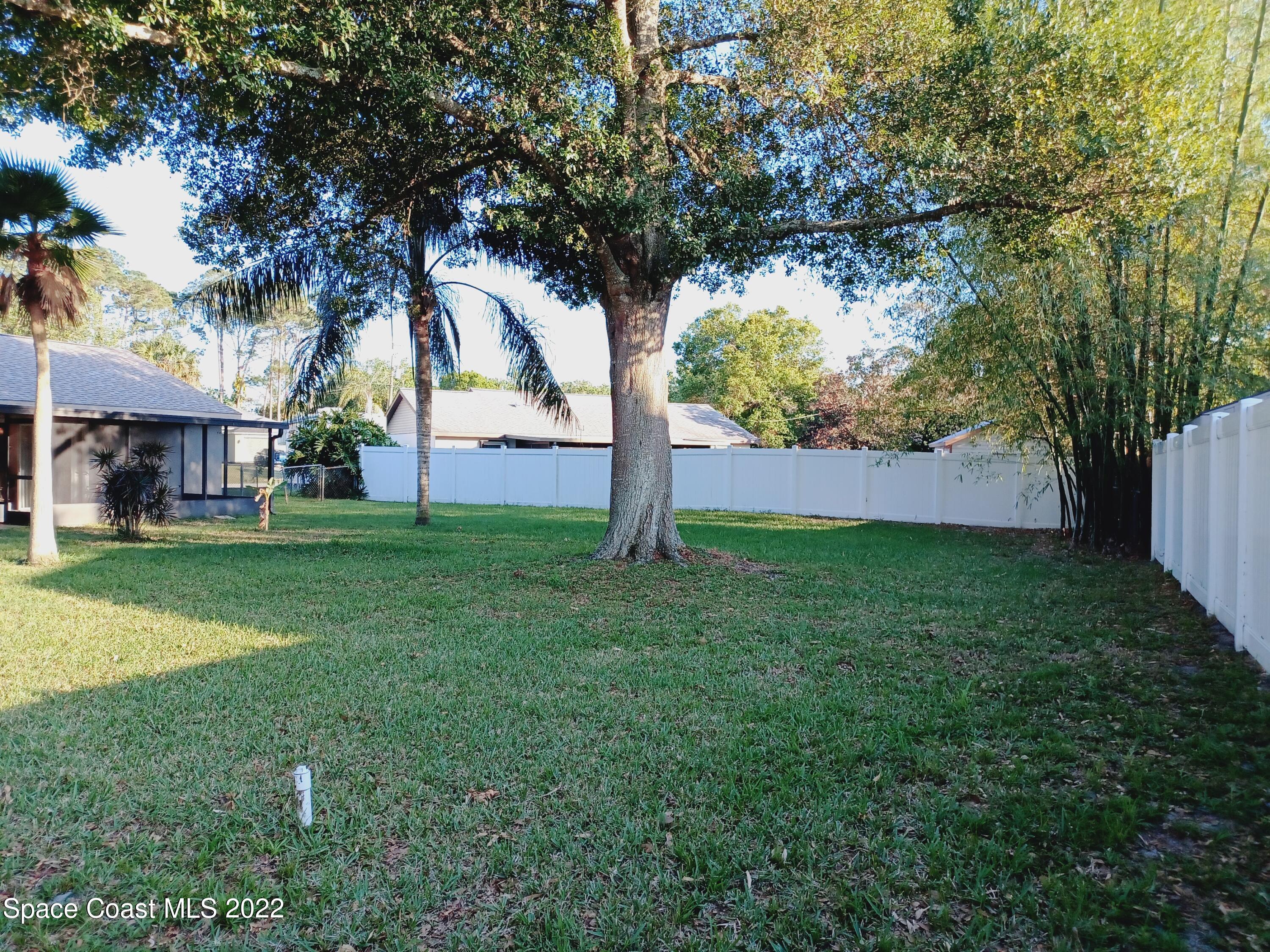 5480 Flint Road Cocoa, FL 32927 - Photo 15 of 20 a view of yard with tree