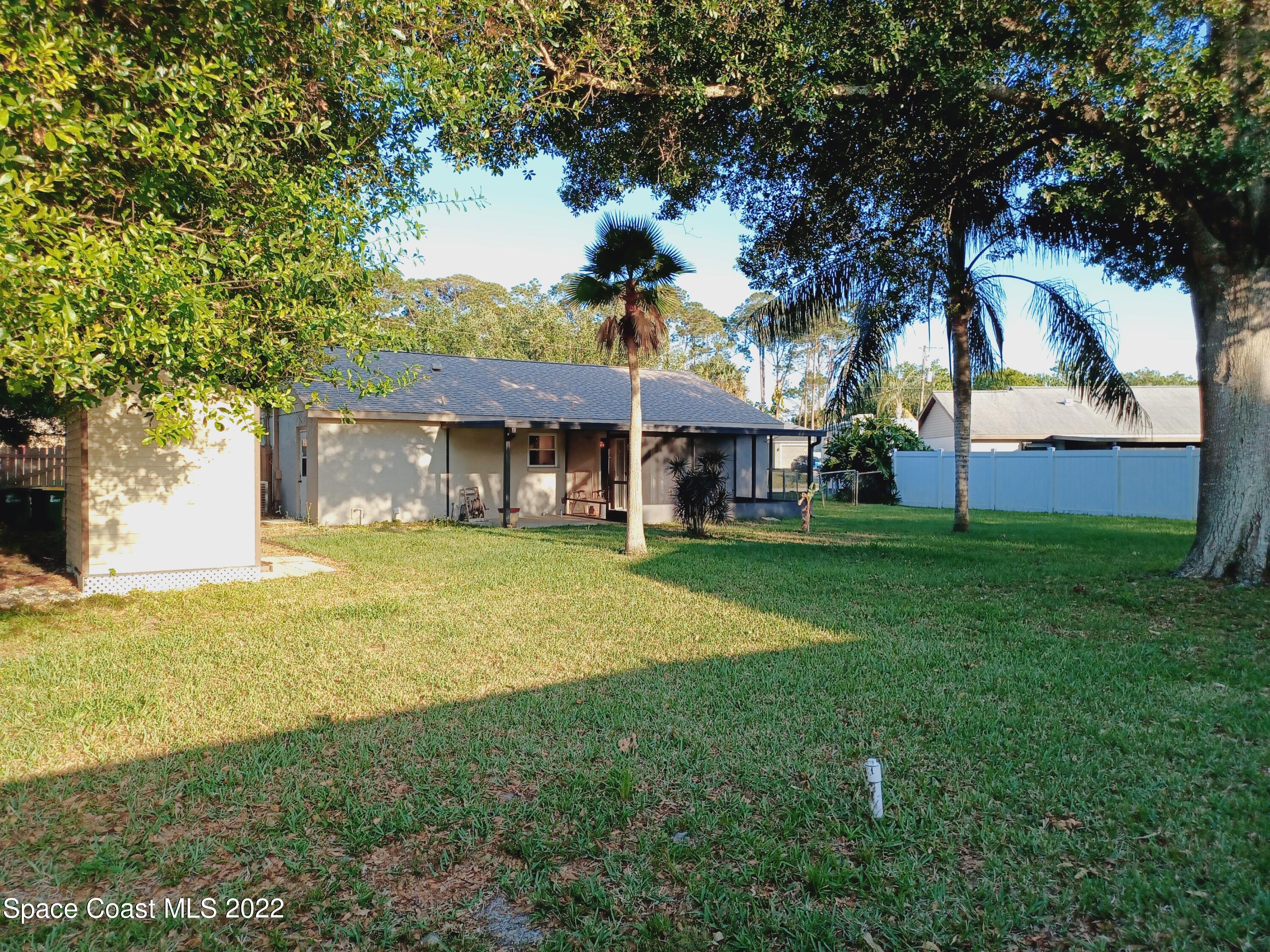 5480 Flint Road Cocoa, FL 32927 - Photo 17 of 20 a front view of a house with garden