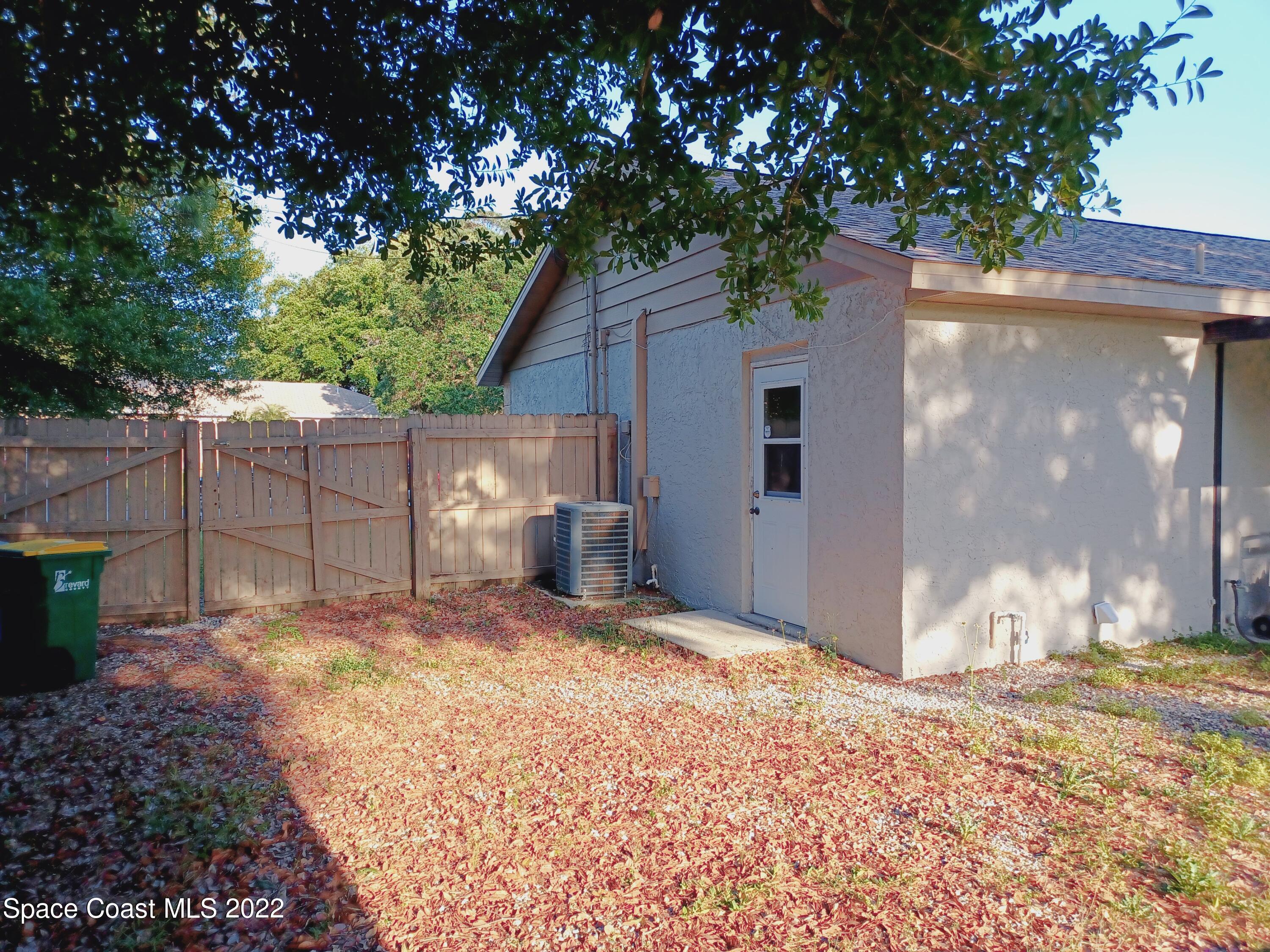 5480 Flint Road Cocoa, FL 32927 - Photo 19 of 20 a view of a house with a yard