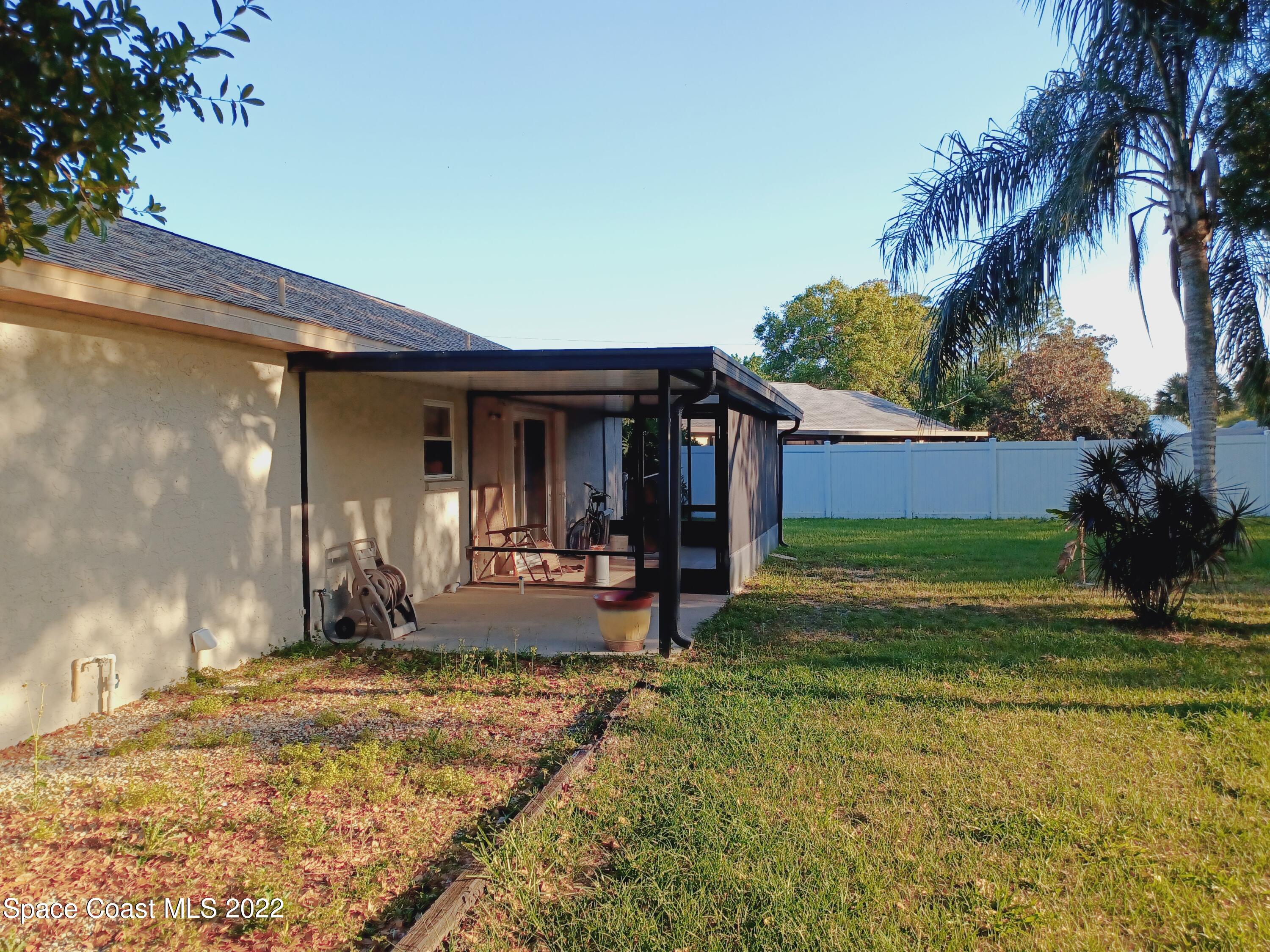 5480 Flint Road Cocoa, FL 32927 - Photo 20 of 20 a front view of a house with garden