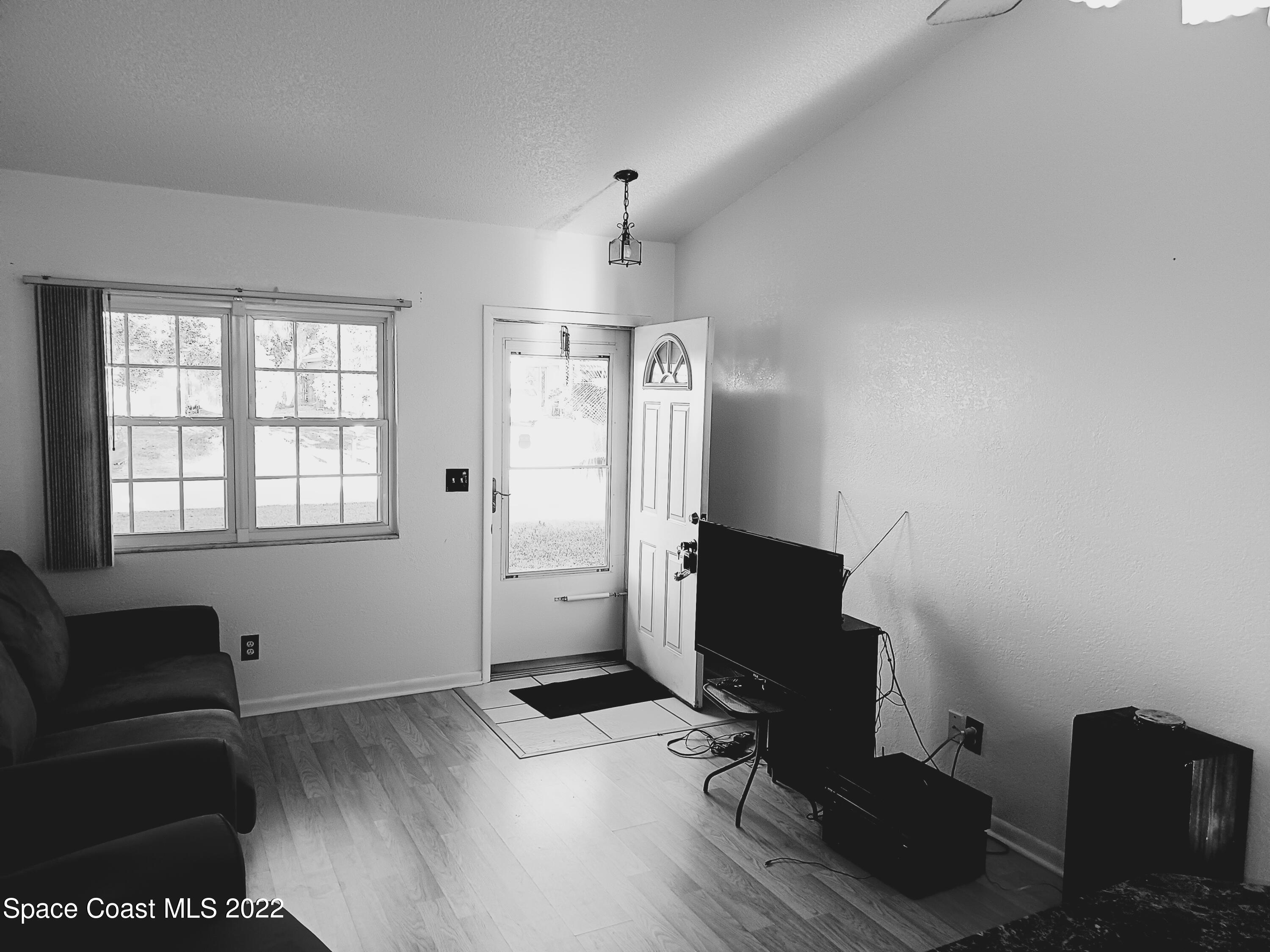 5480 Flint Road Cocoa, FL 32927 - Photo 6 of 20 a view of livingroom with furniture and wooden floor