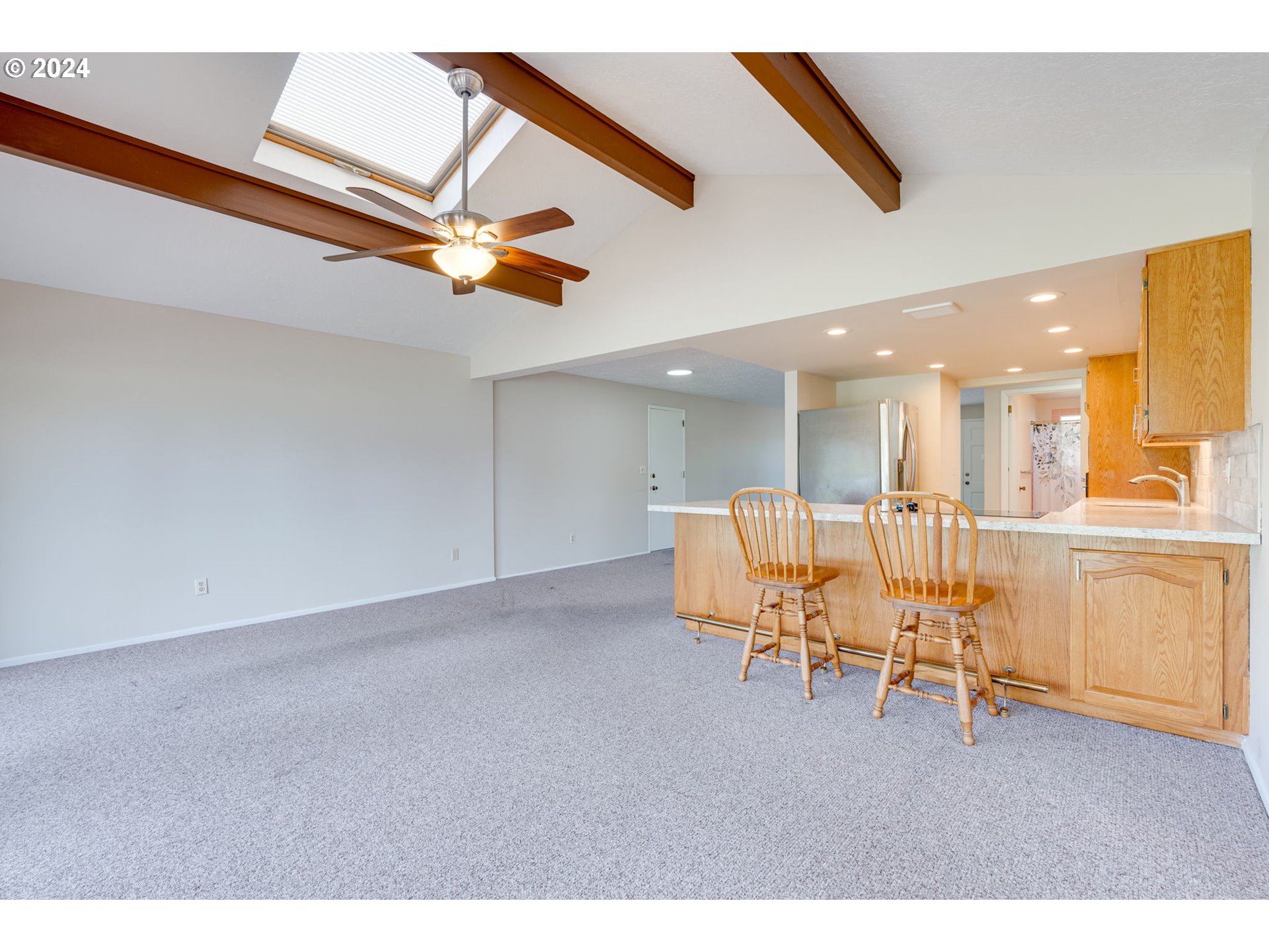 1585 Princeton Road Woodburn, OR 97071 - Photo 17 of 46 a living room with furniture and a kitchen view