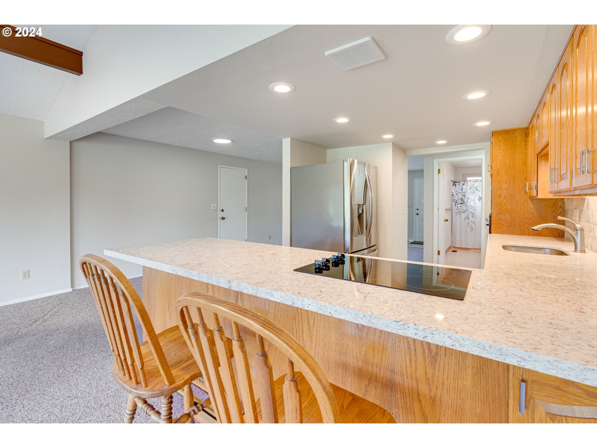1585 Princeton Road Woodburn, OR 97071 - Photo 19 of 46 a large kitchen with stainless steel appliances kitchen island a large counter top