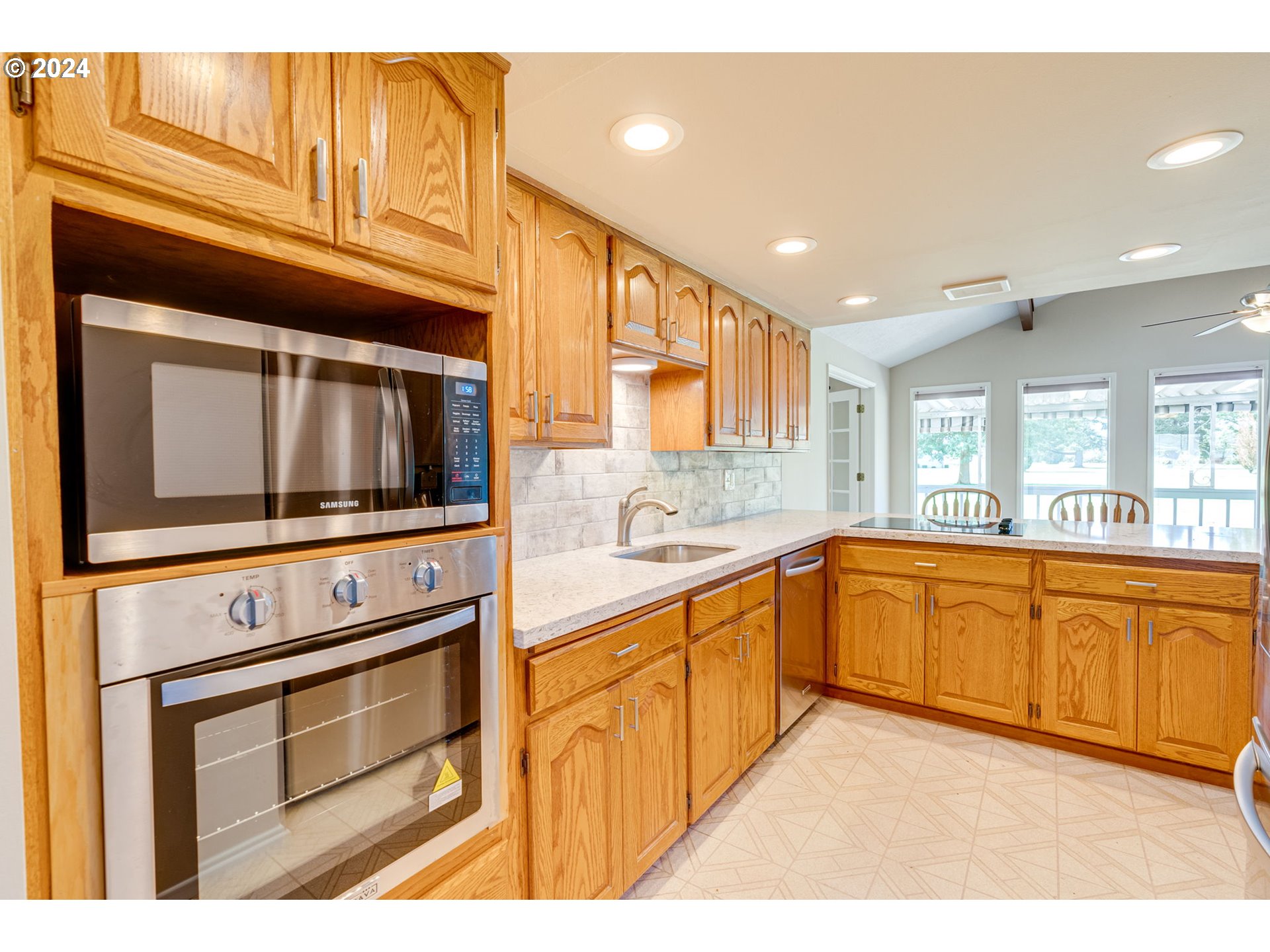 1585 Princeton Road Woodburn, OR 97071 - Photo 21 of 46 a kitchen with stainless steel appliances granite countertop a stove microwave and cabinets
