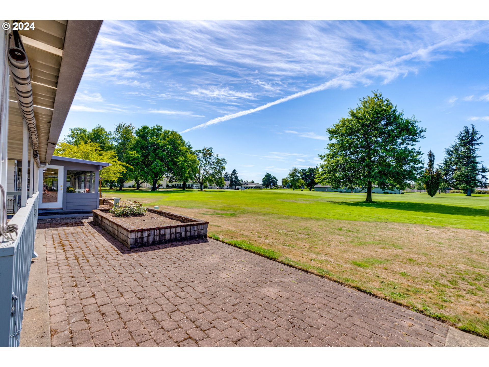 1585 Princeton Road Woodburn, OR 97071 - Photo 4 of 46 a view of a swimming pool with an outdoor space and seating area