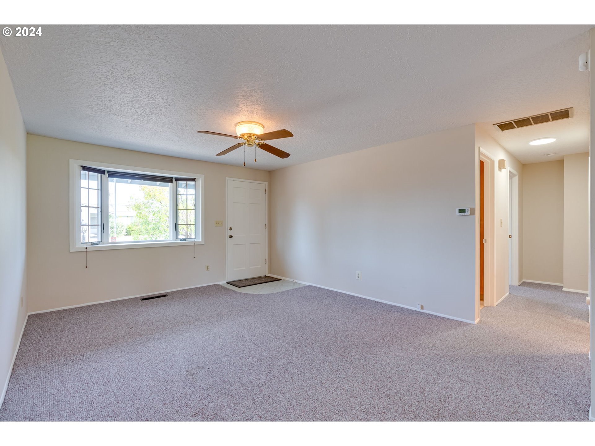 1585 Princeton Road Woodburn, OR 97071 - Photo 10 of 46 a view of an empty room with a window