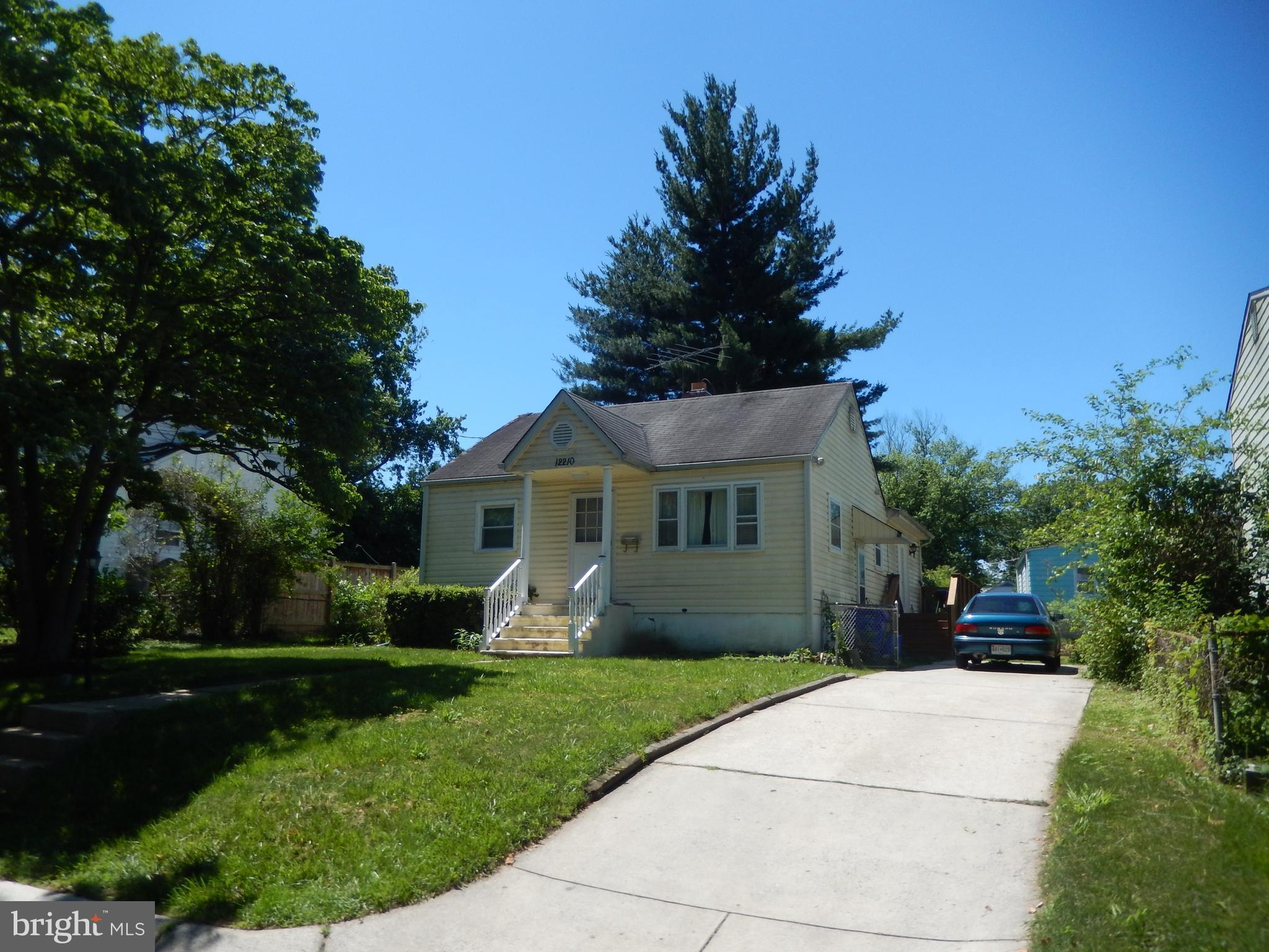 12210 Middle Road Silver Spring, MD 20906 - Photo 1 of 30 a front view of a house with garden