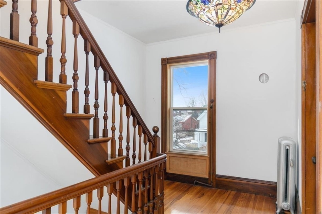 20-22 Florence Street Andover, MA 01810 - Photo 15 of 42 a view of an entryway with wooden floor and door