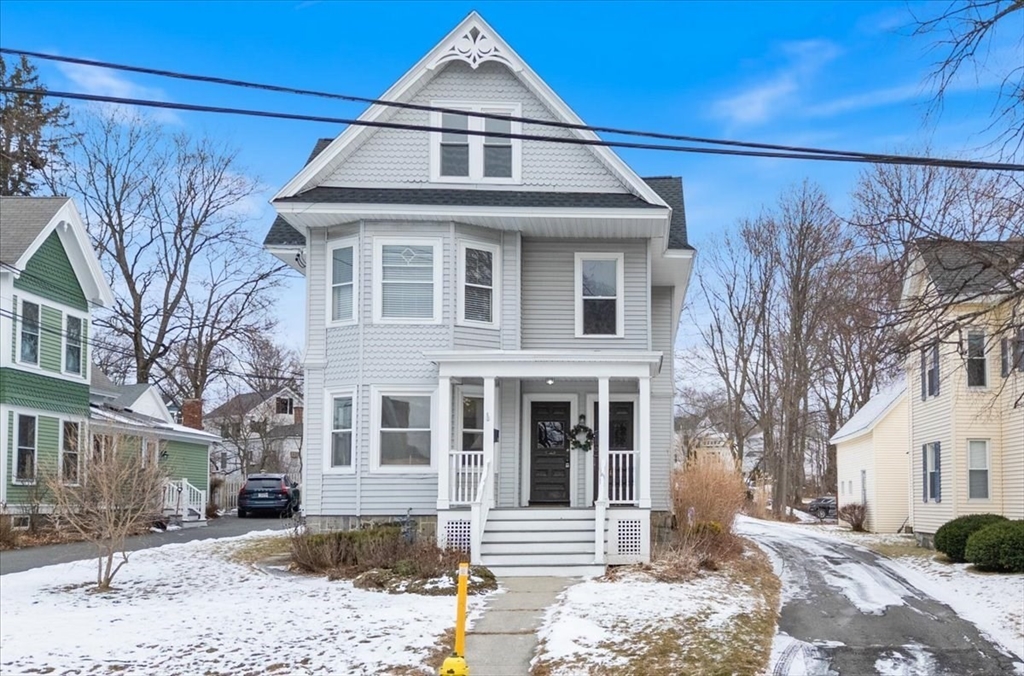 20-22 Florence Street Andover, MA 01810 - Photo 2 of 42 a front view of a house with a yard