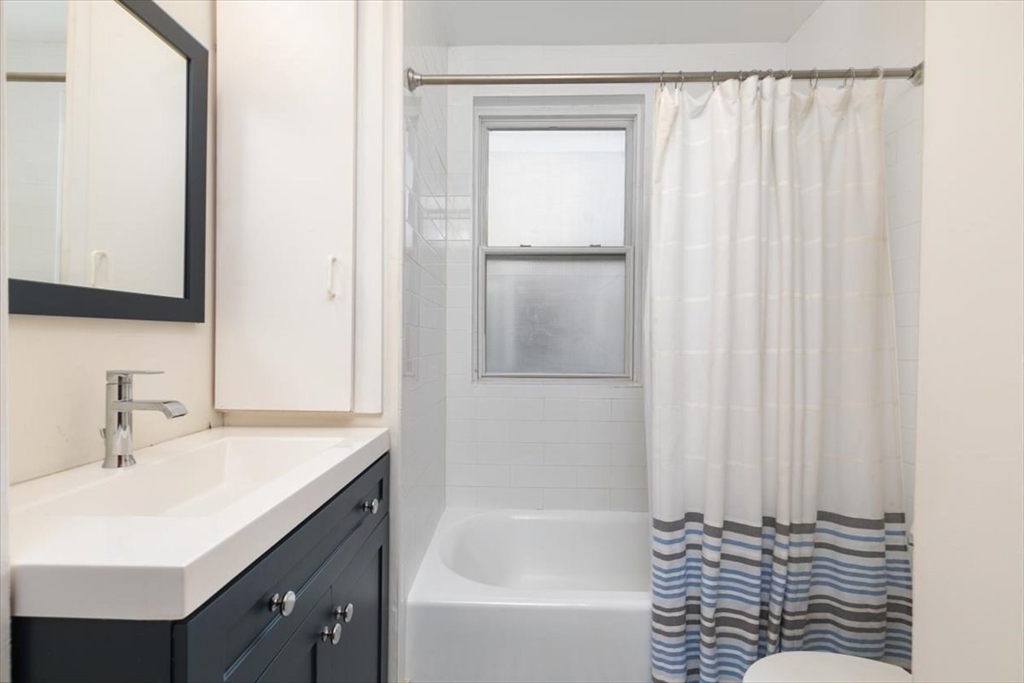 20-22 Florence Street Andover, MA 01810 - Photo 23 of 42 a bathroom with a bathtub and a sink