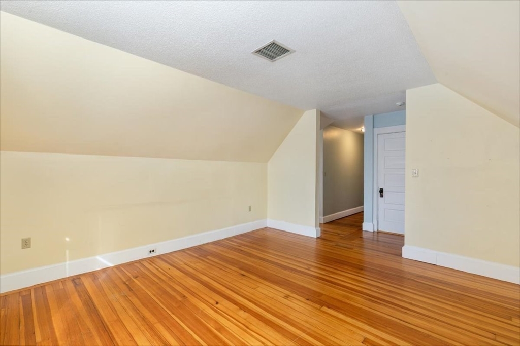 20-22 Florence Street Andover, MA 01810 - Photo 33 of 42 a view of an empty room with wooden floor