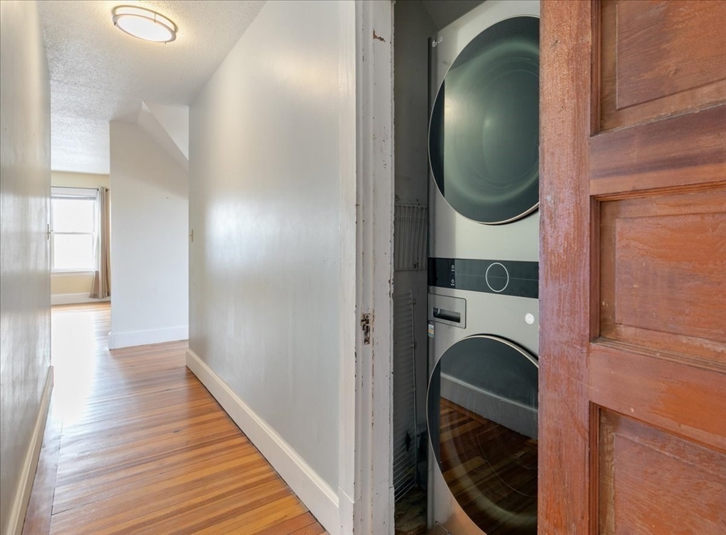20-22 Florence Street Andover, MA 01810 - Photo 38 of 42 a view of a hallway with washer and dryer
