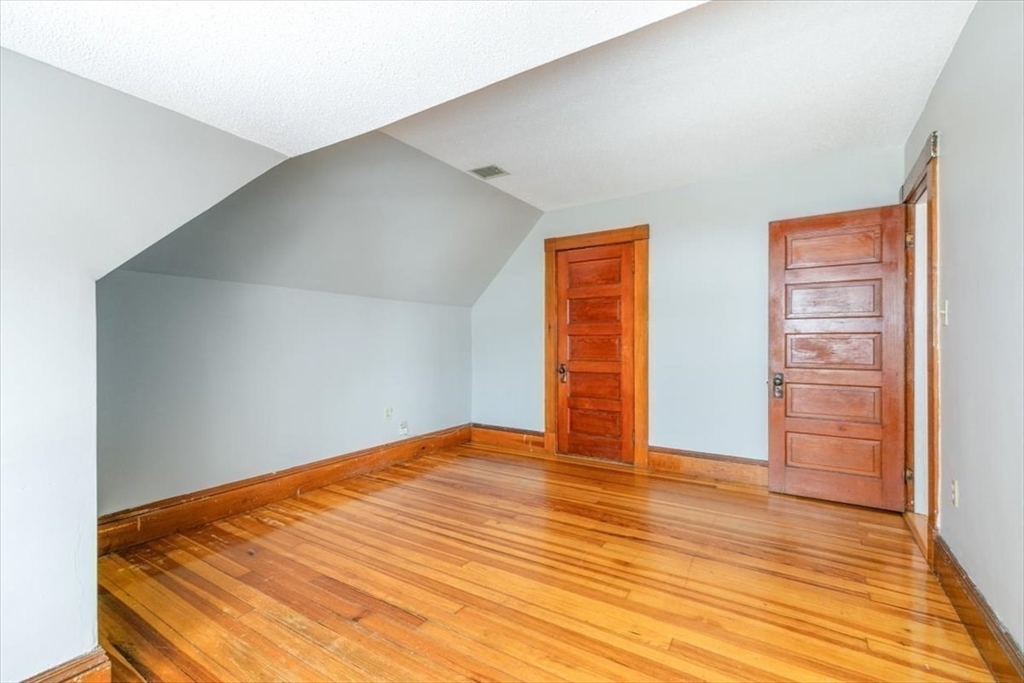20-22 Florence Street Andover, MA 01810 - Photo 40 of 42 a view of an empty room with wooden floor
