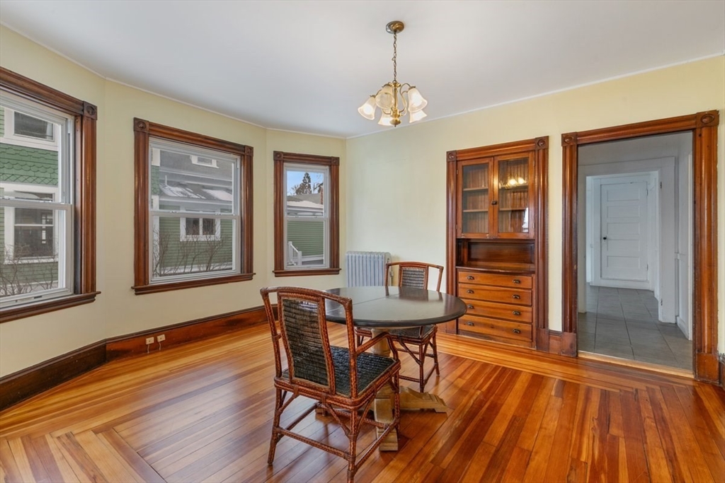 20-22 Florence Street Andover, MA 01810 - Photo 8 of 42 a view of a dining room with furniture and wooden floor