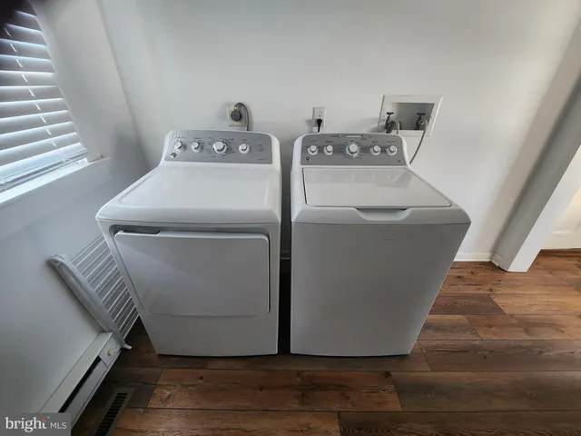 a utility room with washer and dryer