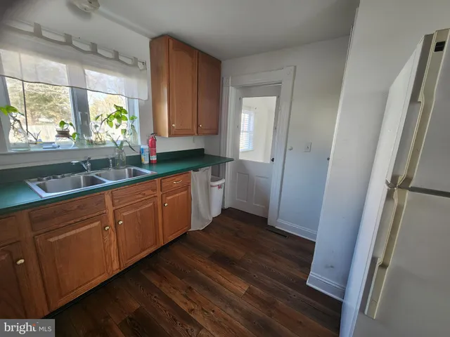 a kitchen with sink and window