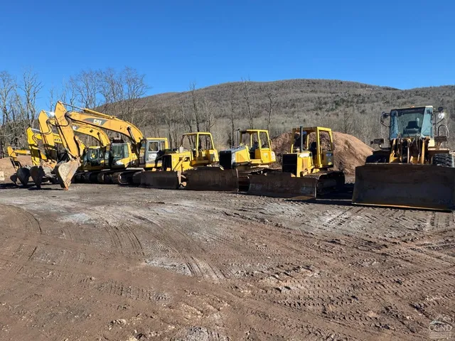 a view of a building with car parked
