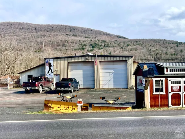 a view of swimming pool with sitting area