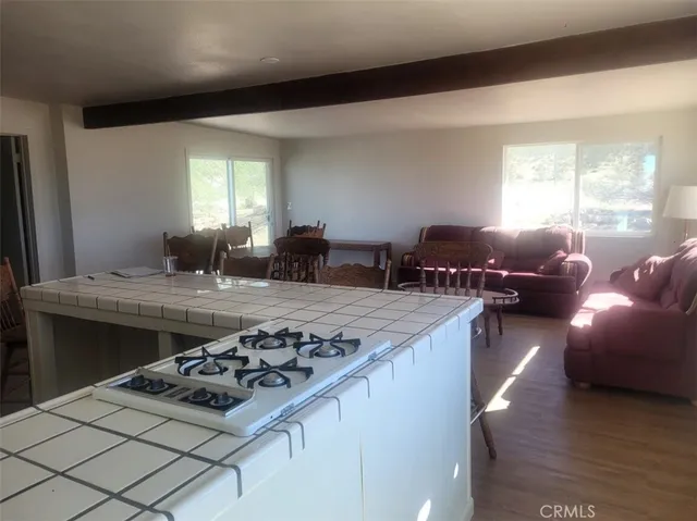 a kitchen with a stove and a window