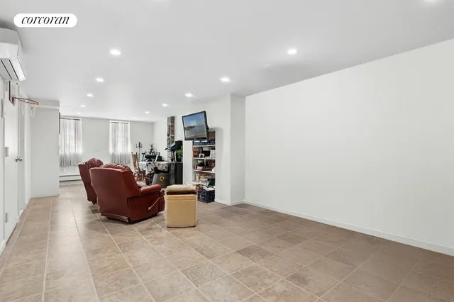 a living room with furniture and a rug