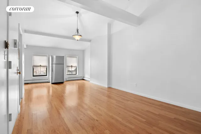 a kitchen with stainless steel appliances granite countertop a stove microwave and refrigerator