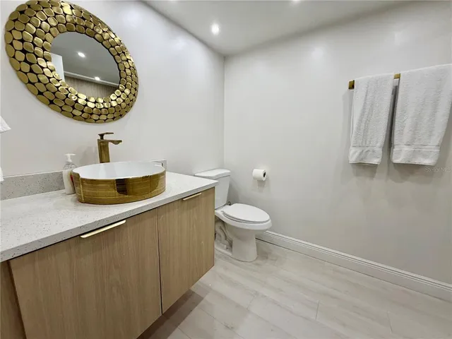 a bathroom with a toilet and a sink
