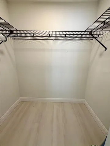 a view of a room with racks on the wall