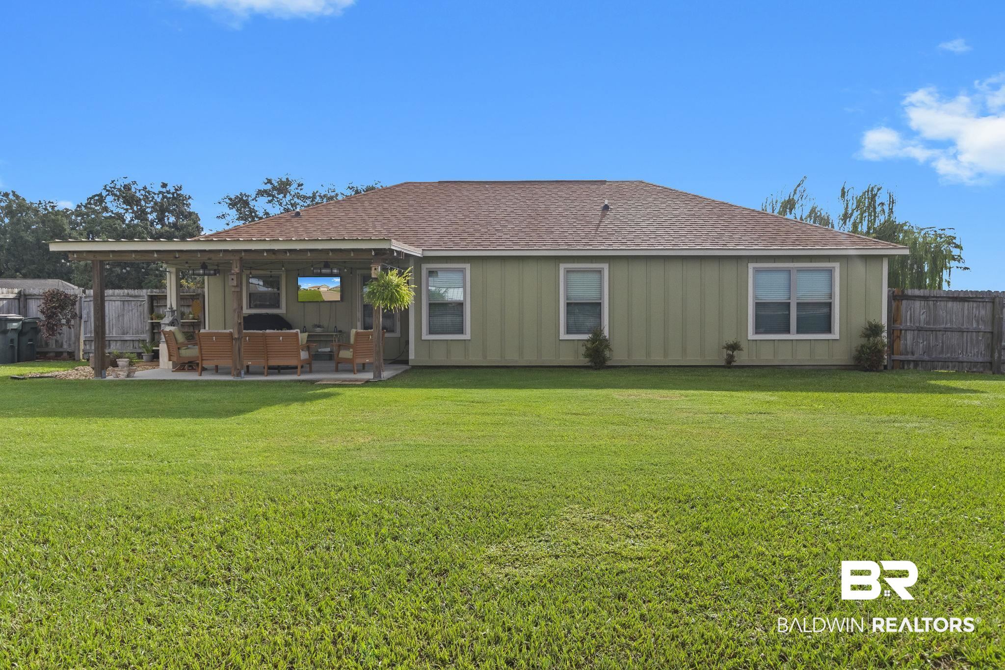 203 Lakefront Circle Summerdale, AL 36580 - Photo 59 of 69 Rear view of property with an outdoor living space, a lawn, and a patio