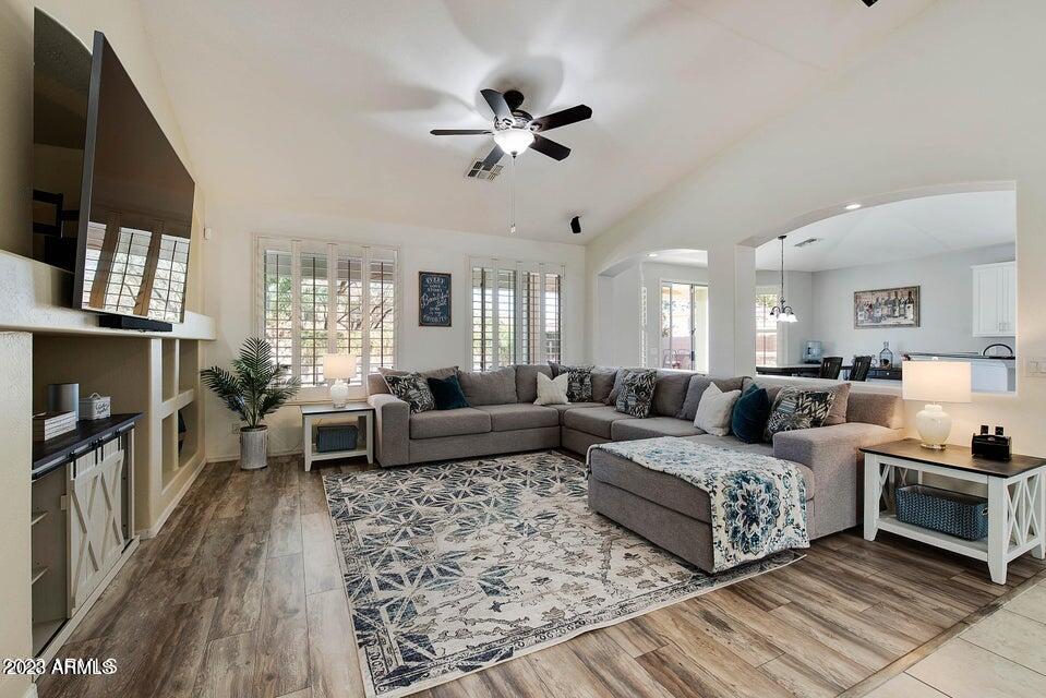 2624 West Summerside Road Phoenix, AZ 85041 - Photo 16 of 31 a living room with furniture fireplace and a flat screen tv