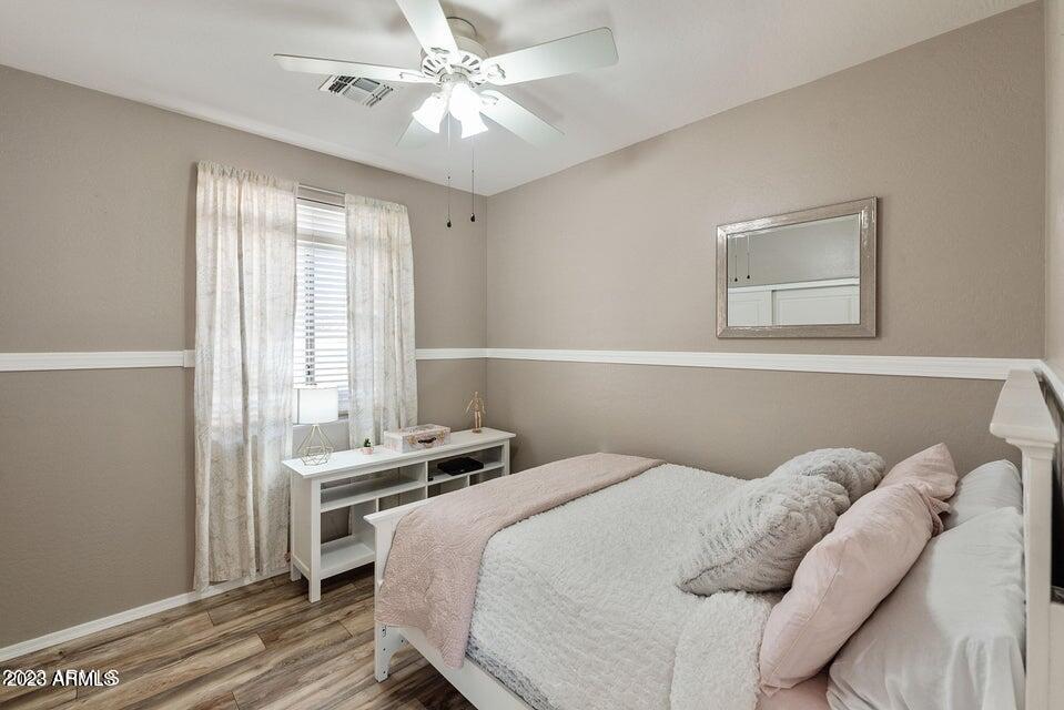 2624 West Summerside Road Phoenix, AZ 85041 - Photo 20 of 31 a bedroom with a bed and a window