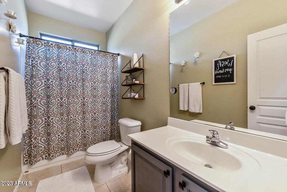2624 West Summerside Road Phoenix, AZ 85041 - Photo 21 of 31 a bathroom with a sink toilet and shower