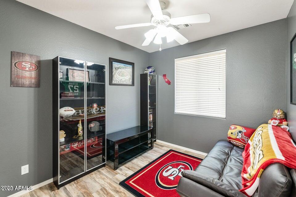 2624 West Summerside Road Phoenix, AZ 85041 - Photo 22 of 31 a bed room with a bed and a window