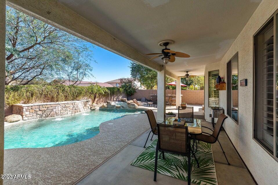 2624 West Summerside Road Phoenix, AZ 85041 - Photo 25 of 31 a view of a patio with a table and chairs