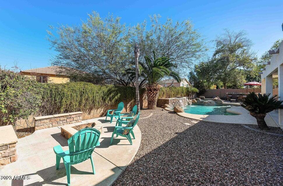 2624 West Summerside Road Phoenix, AZ 85041 - Photo 28 of 31 a view of a patio with couches table and chairs and potted plants