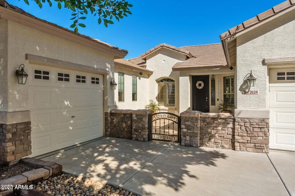 2624 West Summerside Road Phoenix, AZ 85041 - Photo 31 of 31 a front view of a house with a garage