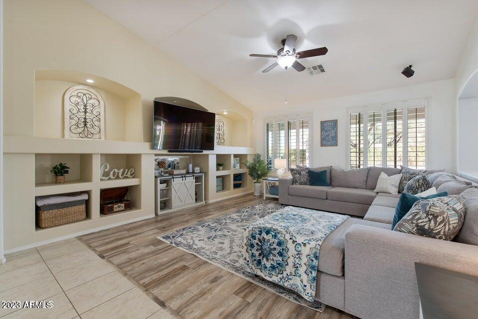 2624 West Summerside Road Phoenix, AZ 85041 - Photo 4 of 31 a living room with furniture and a fireplace