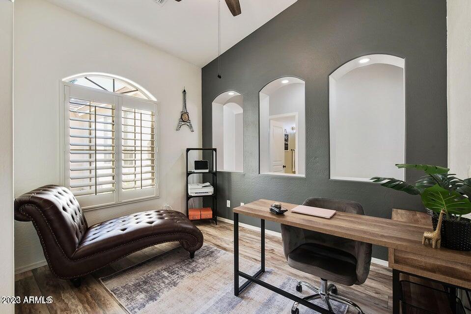 2624 West Summerside Road Phoenix, AZ 85041 - Photo 7 of 31 a living room with furniture and a potted plant