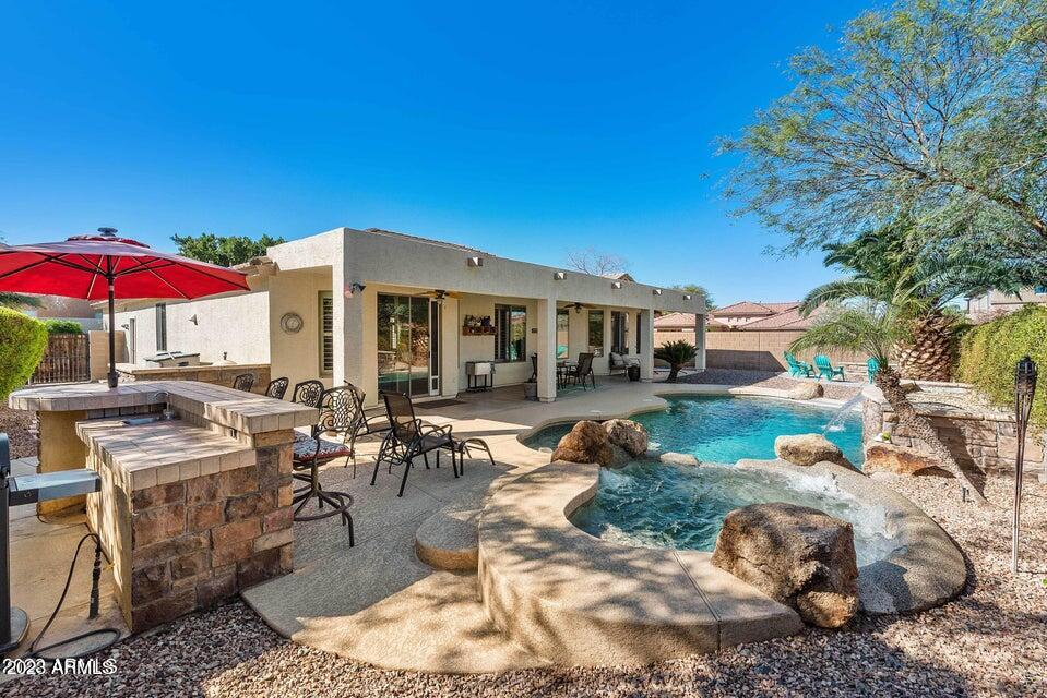 2624 West Summerside Road Phoenix, AZ 85041 - Photo 9 of 31 a view of a house with backyard porch and patio