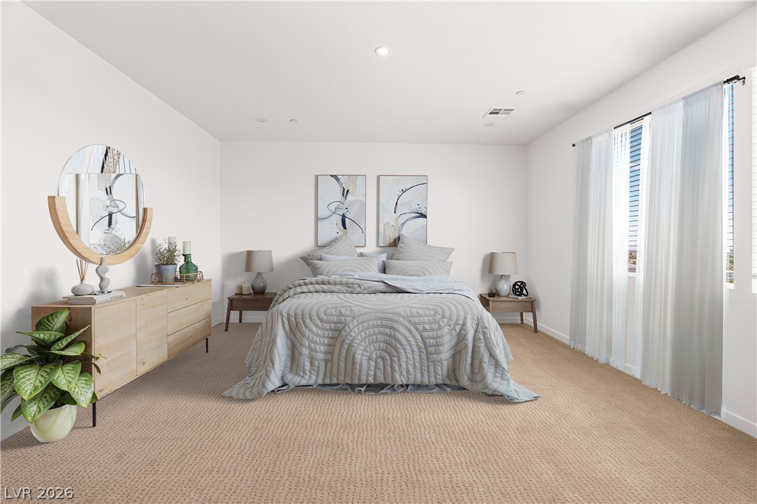 11027 Socrates Ridge Street Las Vegas, NV 89141 - Photo 5 of 20 Plush carpeting creates a serene atmosphere in this naturally illuminated primary bedroom.