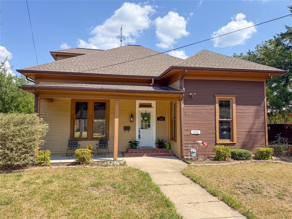 a view of a brick house with a large windows