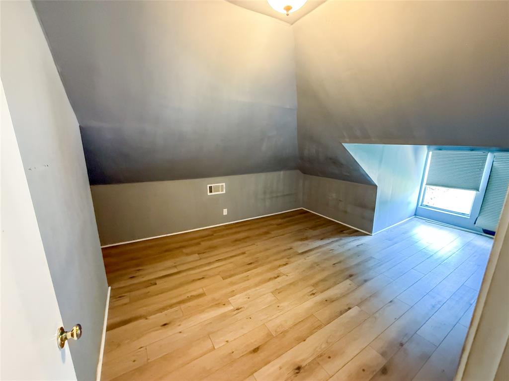 1210 Monroe Street Commerce, TX 75428 - Photo 17 of 20 a view of empty room with wooden floor