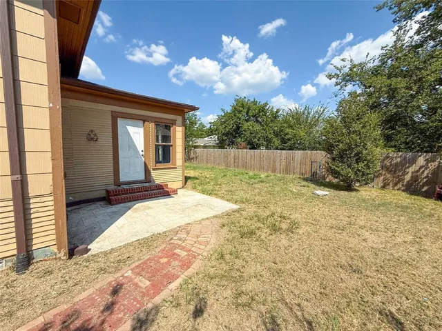 a view of a house with pool and sitting area
