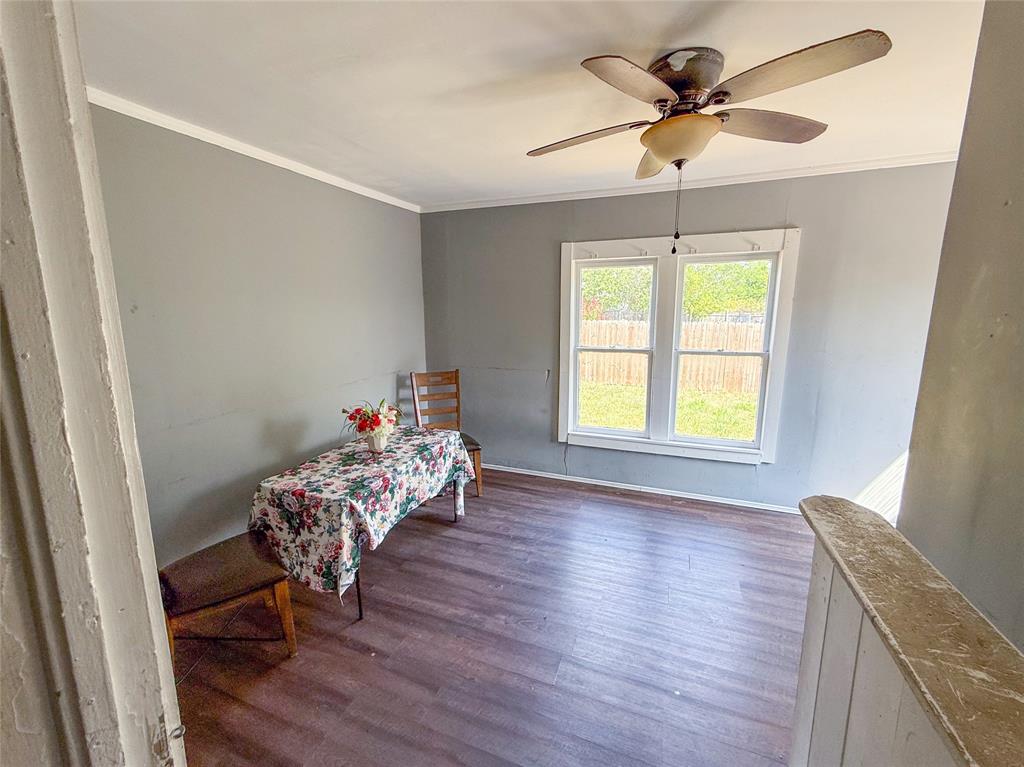 1210 Monroe Street Commerce, TX 75428 - Photo 7 of 20 a living room with furniture and a window