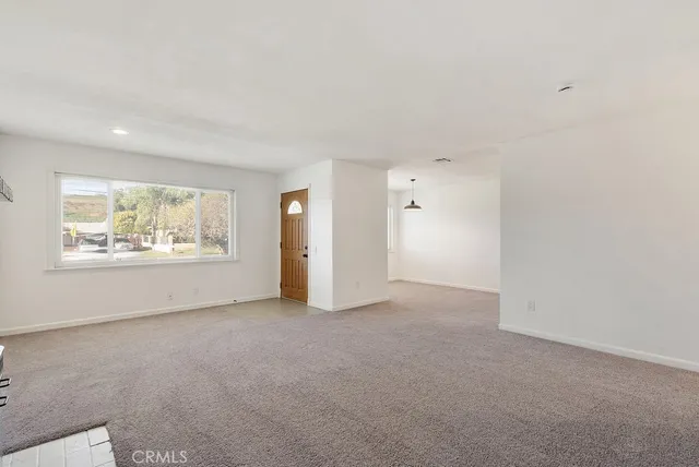 a view of a room with a large window