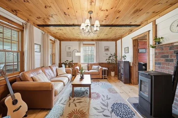 a living room with furniture ceiling fan and a rug