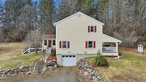 a view of a house with a yard