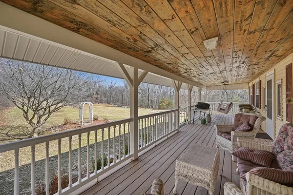 a view of balcony with furniture